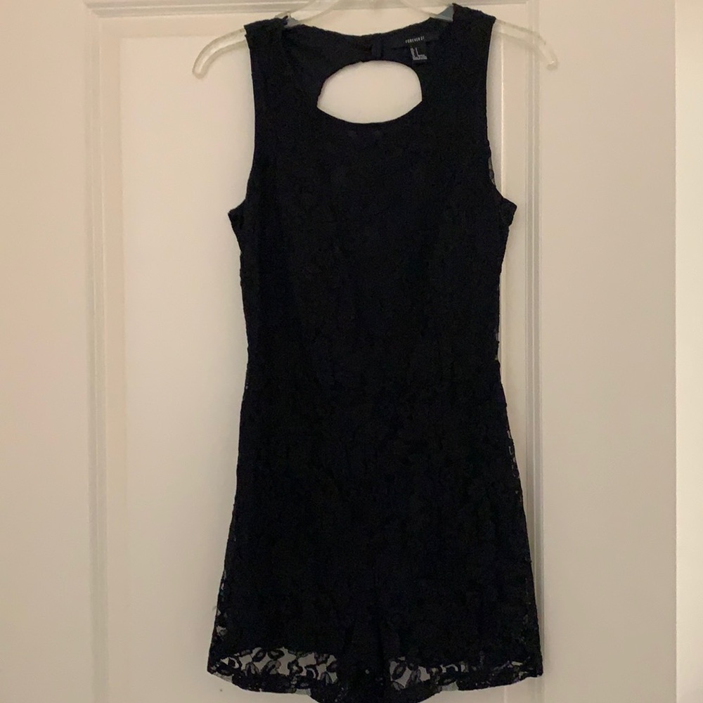All black shirt jumpsuit.